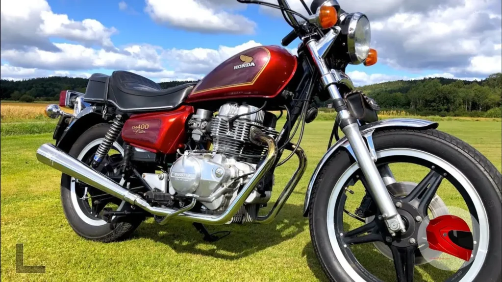 A red Honda CM400 Custom (C trim) with ComStar wheels and a front disc brake — the upmarket contrast to the CM400E's wire-spoke wheels and drum brakes.