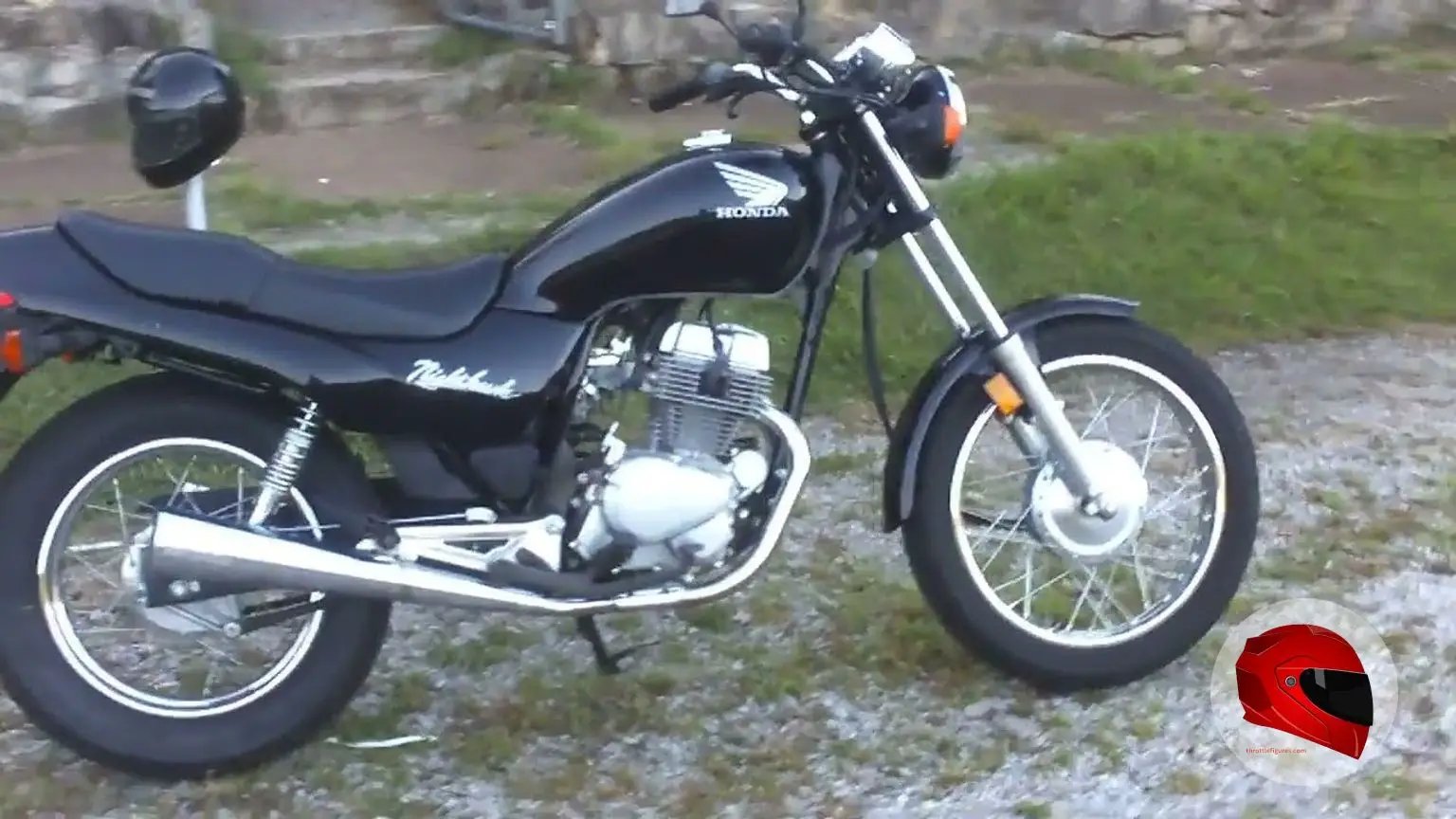 Black Honda CB250 Nighthawk parked outdoors, side view