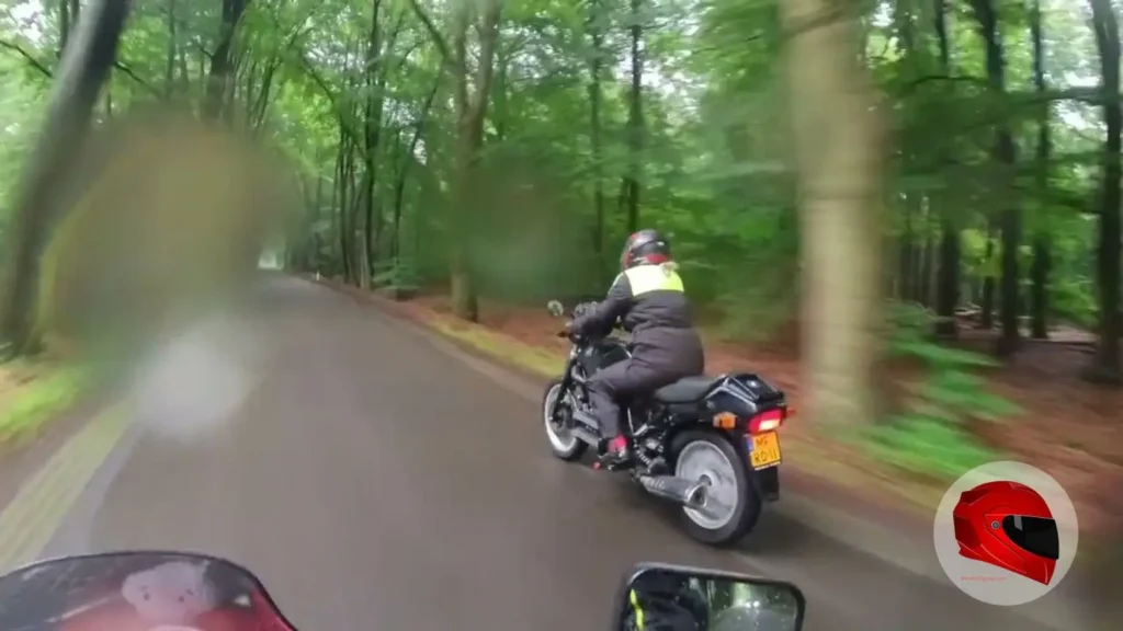 BMW K75 being ridden on a forest road