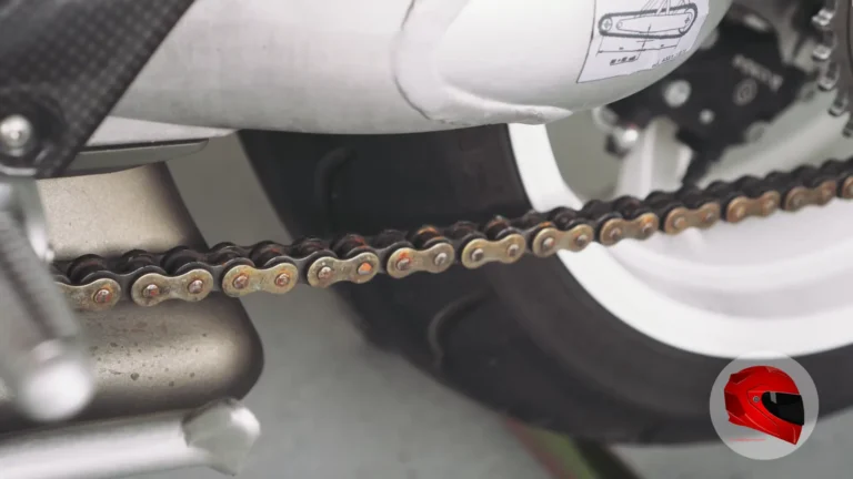 Close-up of a motorcycle drive chain and rear wheel