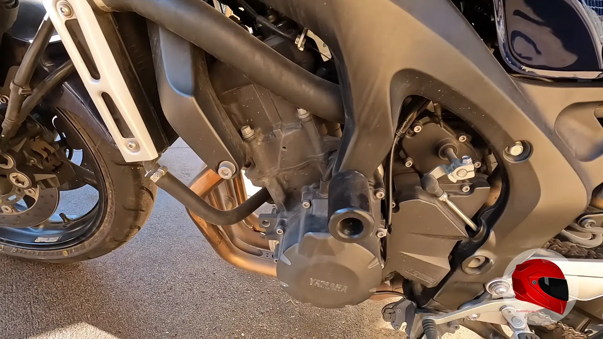 Close-up of a motorcycle engine and frame during inspection