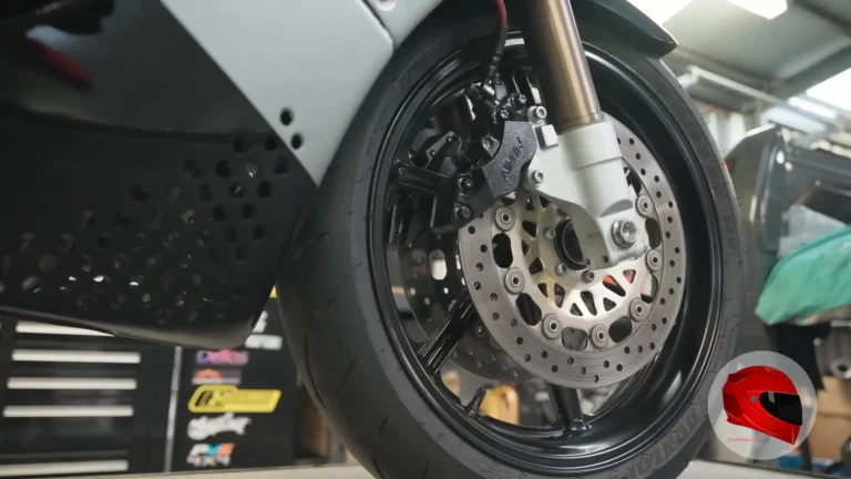 Close-up of a motorcycle front brake disc and caliper