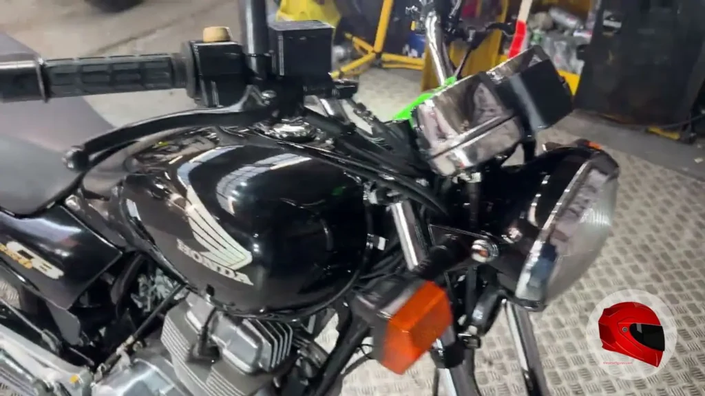 Close view of a Honda CB250 Nighthawk front end, tank and twin-cylinder engine