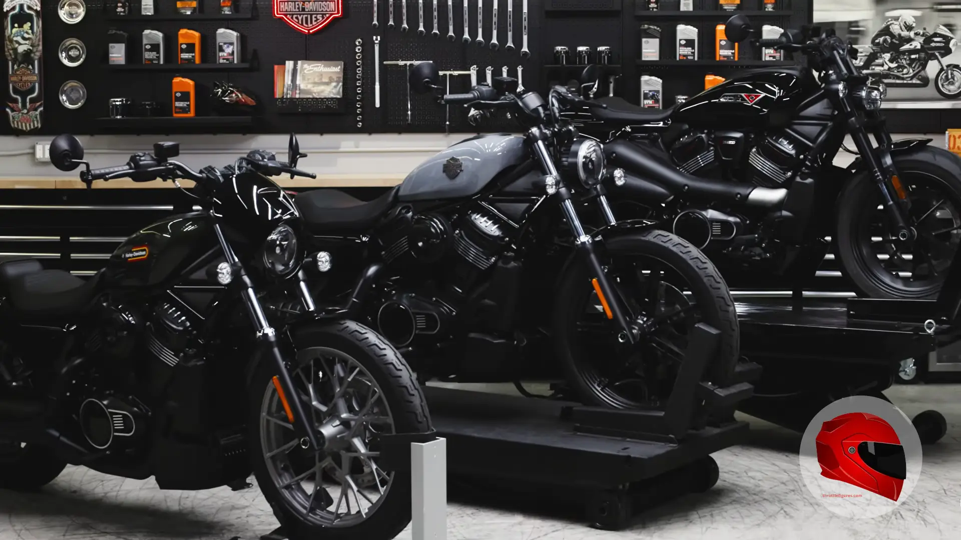 Harley-Davidson motorcycles lined up in a workshop