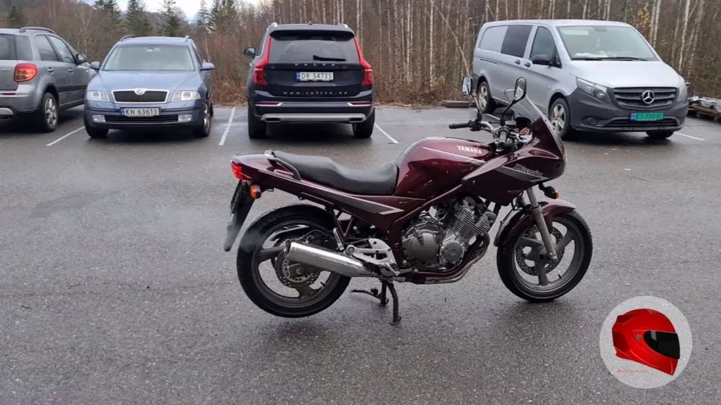 Maroon 1995 Yamaha XJ600S Diversion in full side profile, showing its half-fairing