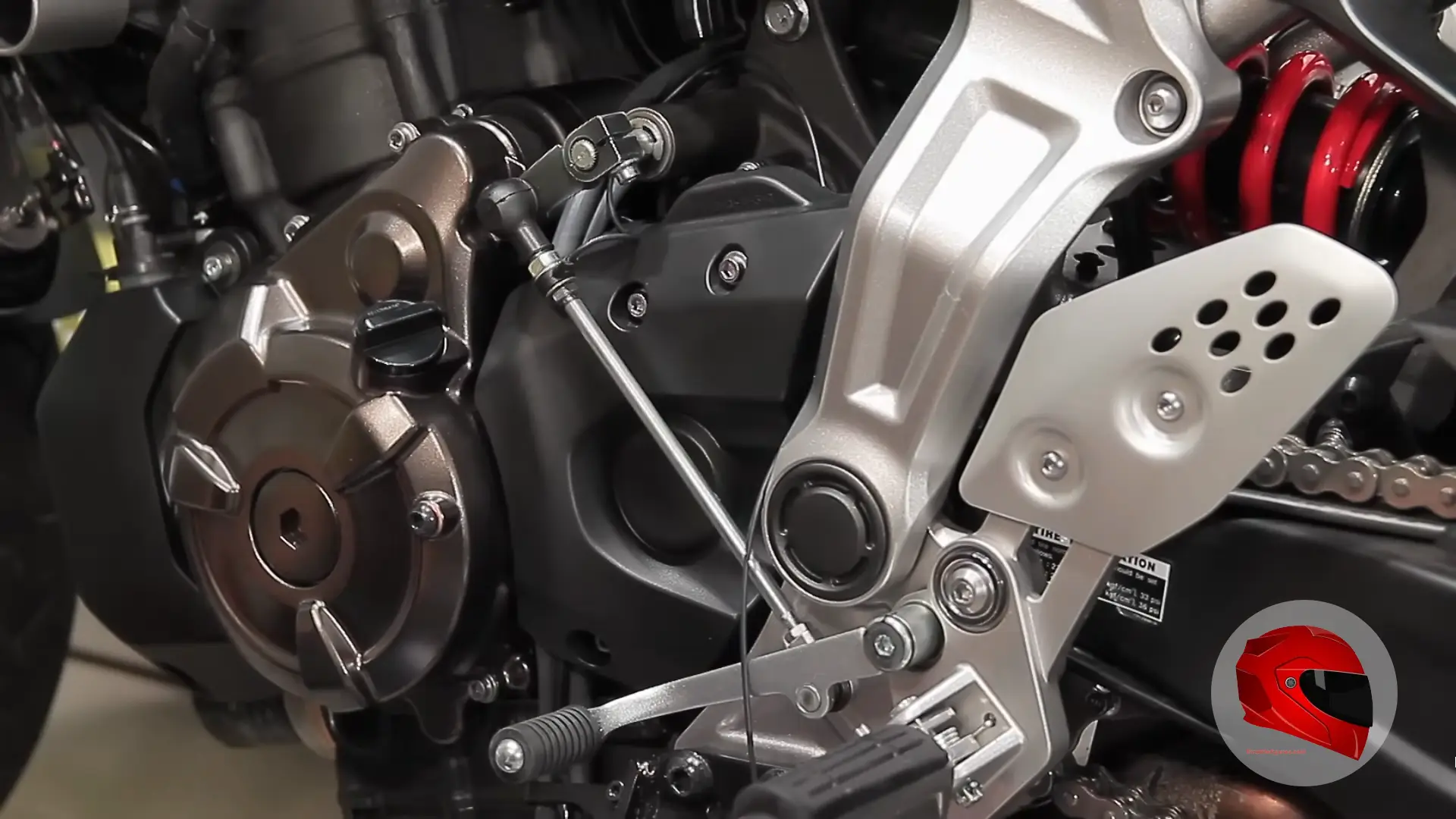 Motorcycle gear shift lever and quickshifter linkage close-up