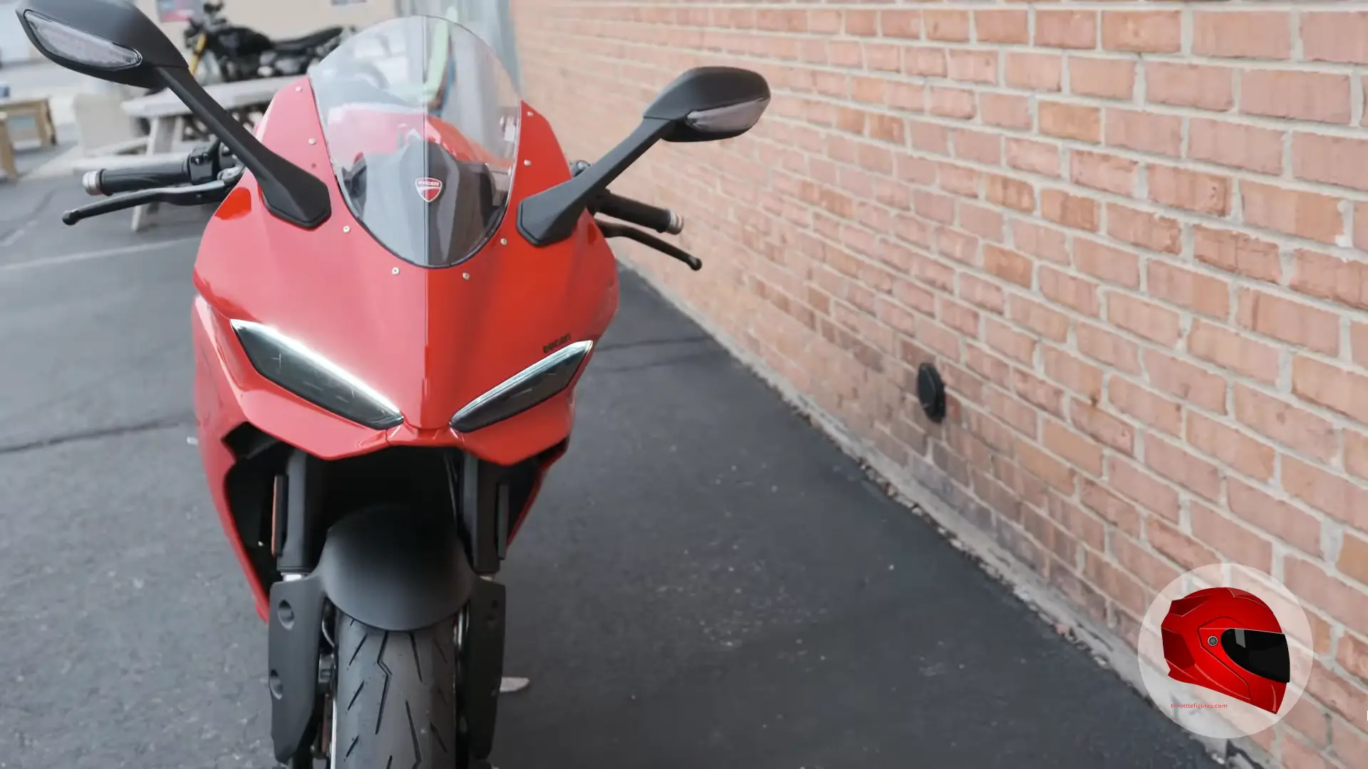 Motorcycle mirrors and handlebars on a parked sportbike