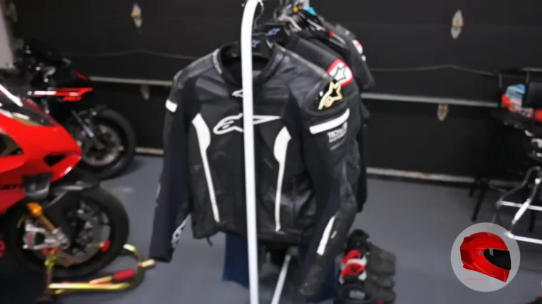 Motorcycle riding gear: leather jackets on a rack with sportbike