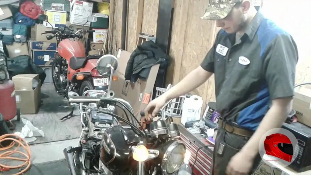 Owner working on a 1981 Honda CM400E in a garage