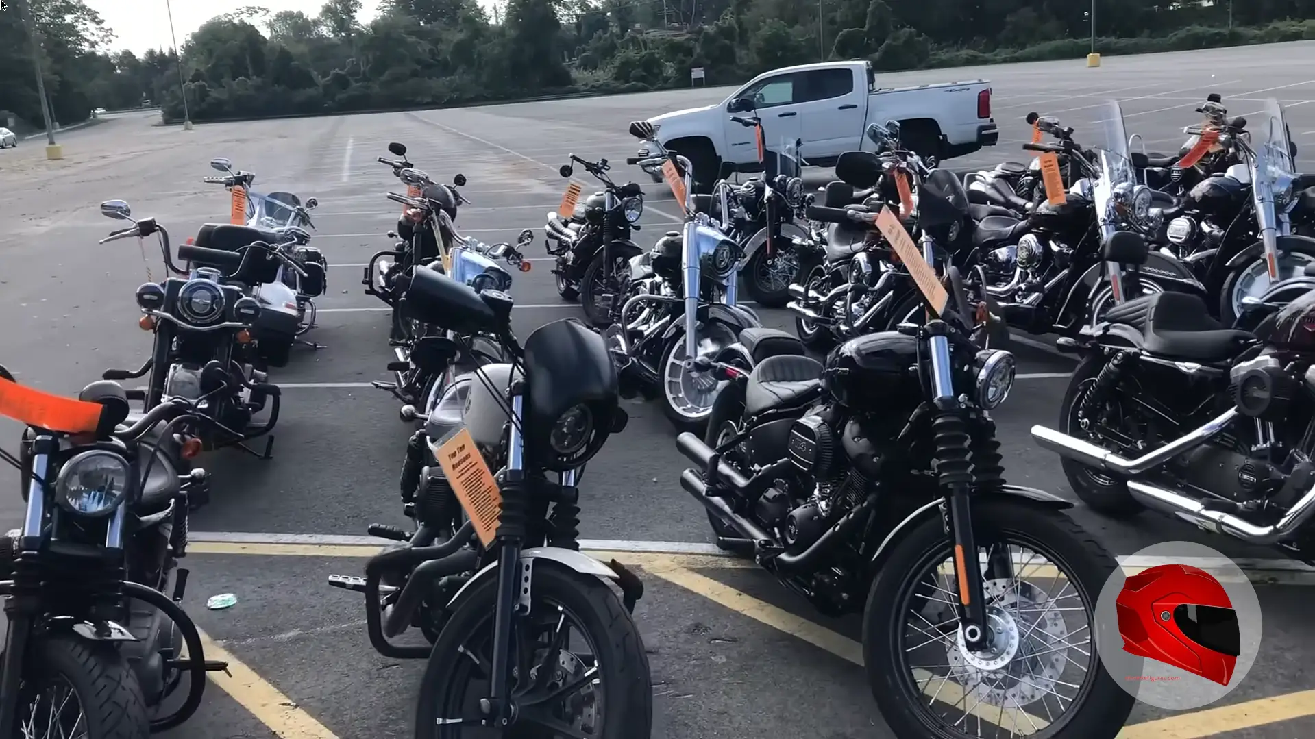 Pre-owned motorcycles lined up at a dealership