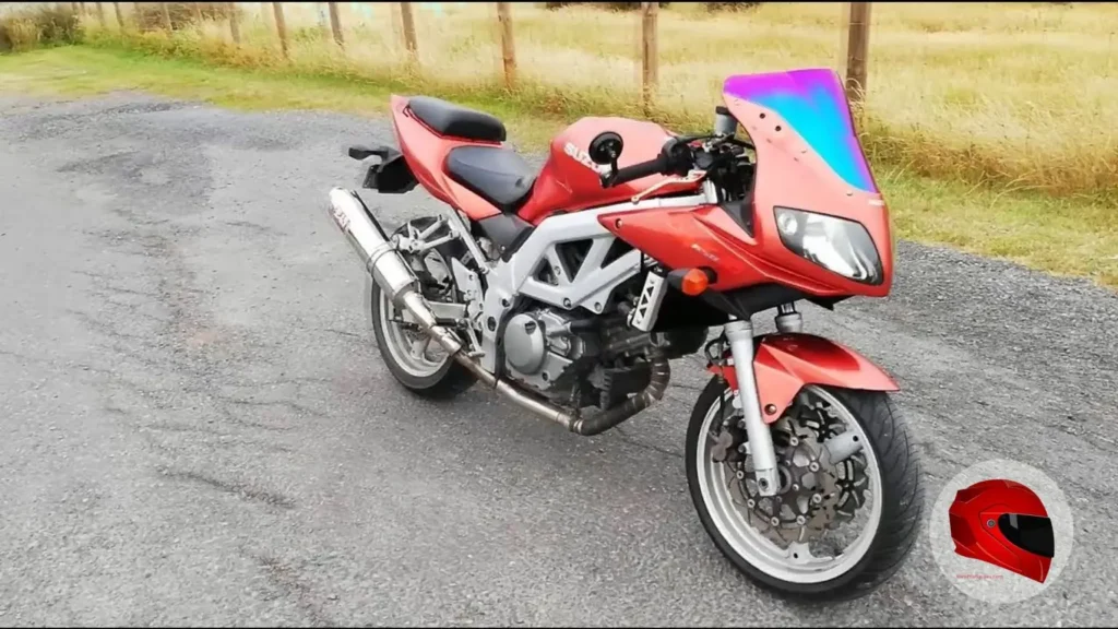 Red 2003 Suzuki SV650S showing the second-generation angular half-fairing and aluminum truss frame