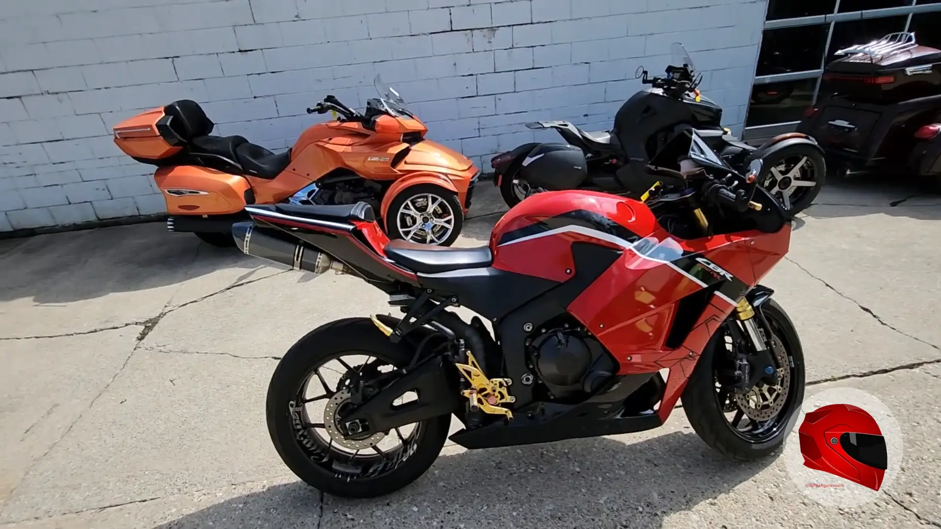 Red Honda CBR600RR parked on concrete