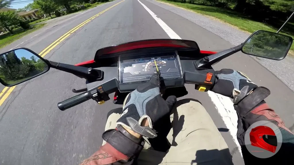 Rider's view from a Honda Elite 80 on the road, speedometer visible