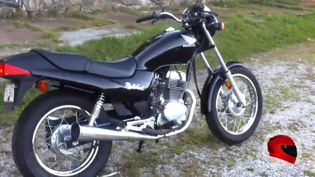 Used black Honda CB250 Nighthawk parked on gravel, right-side view
